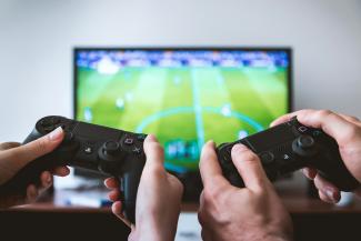 two people playing Sony PS4 game console by JESHOOTS.COM courtesy of Unsplash.