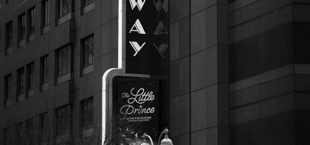 a black and white photo of a broadway sign by Quentin BASNIER courtesy of Unsplash.